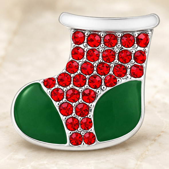 Christmas stocking snap jewelry charm with green enamel toe and heel sections and red rhinestones covering the upper part