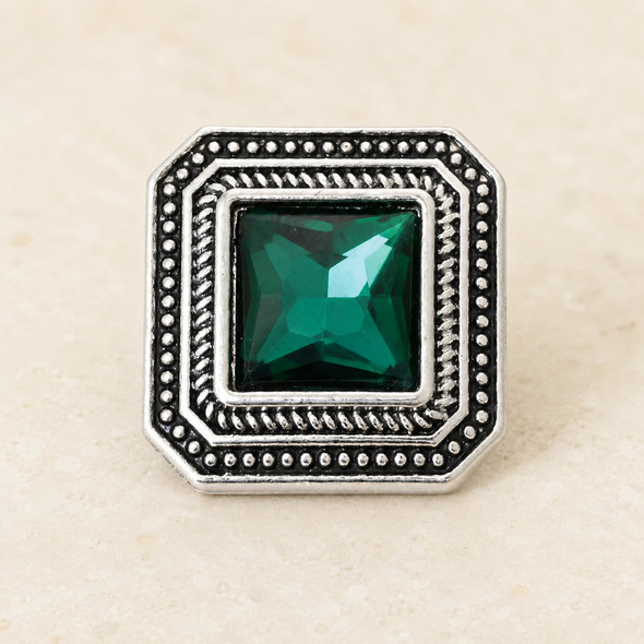 square snap jewelry charm with a faceted green stone center and detailed silver-toned beaded frame