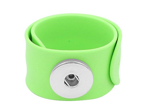 green silicone slap bracelet with a silver snap holder for interchangeable snap jewelry charms