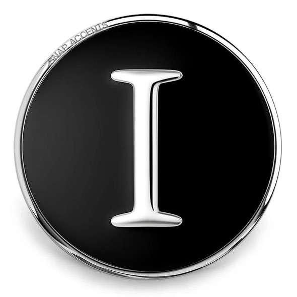 SnapAccents round snap jewelry charm with black background and silver letter "I" initial, polished metal edge, interchangeable fashion accessory for bracelets and necklaces.