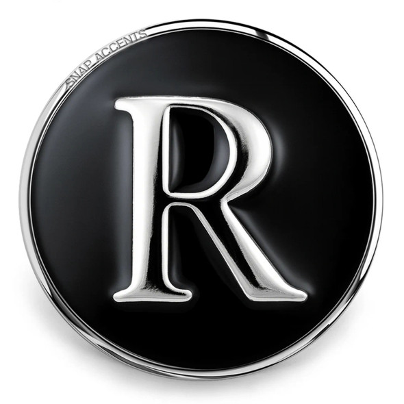 Black SnapAccents snap jewelry charm with silver letter "R" initial, round metal accessory for interchangeable snap bracelets and necklaces, stylish personalized gift option.
