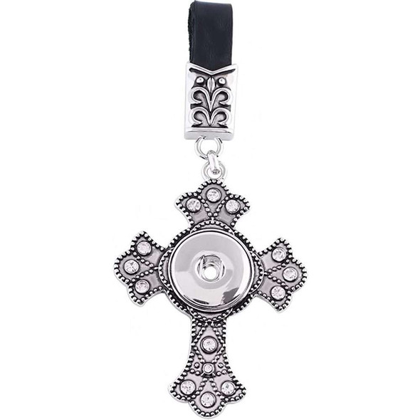 Silver-tone ornate cross snap jewelry charm with clear rhinestones, attached to black leather strap with decorative metal clasp, designed for interchangeable snap buttons.