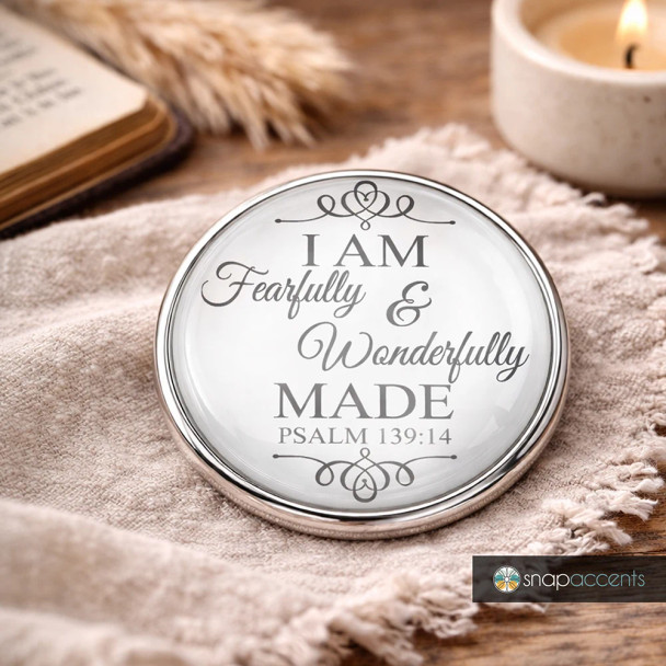 Round SnapAccents snap jewelry charm with inspirational Psalm 139:14 quote "I am fearfully & wonderfully made," elegant script design, silver-tone metal frame, displayed on soft fabric with cozy background, perfect for faith-based personalized snap jewelry accessories.