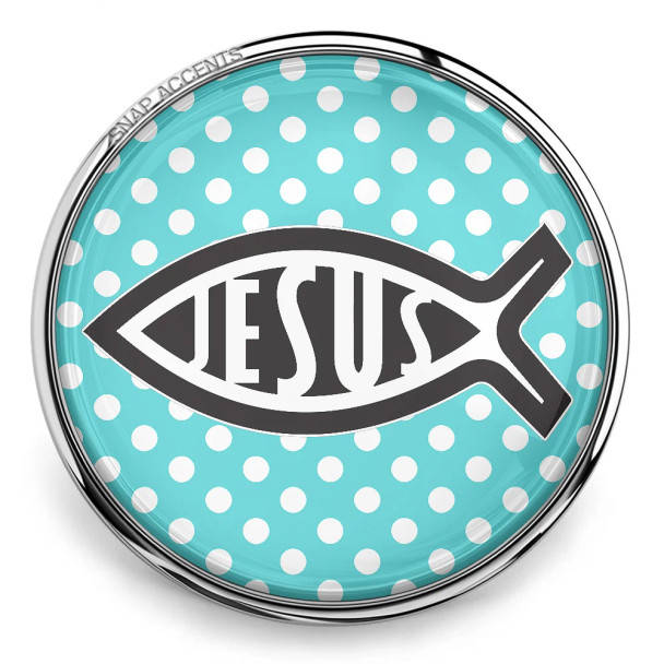 SnapAccents round snap jewelry charm featuring a black Jesus fish symbol with the word "JESUS" inside, set against a turquoise background with white polka dots, encased in a silver metal frame, perfect for faith-inspired interchangeable snap jewelry accessories.