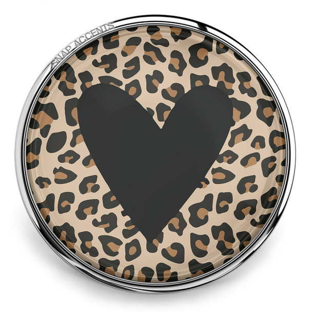 round snap jewelry charm with a black heart over a brown and black animal print background in a silver metal setting
