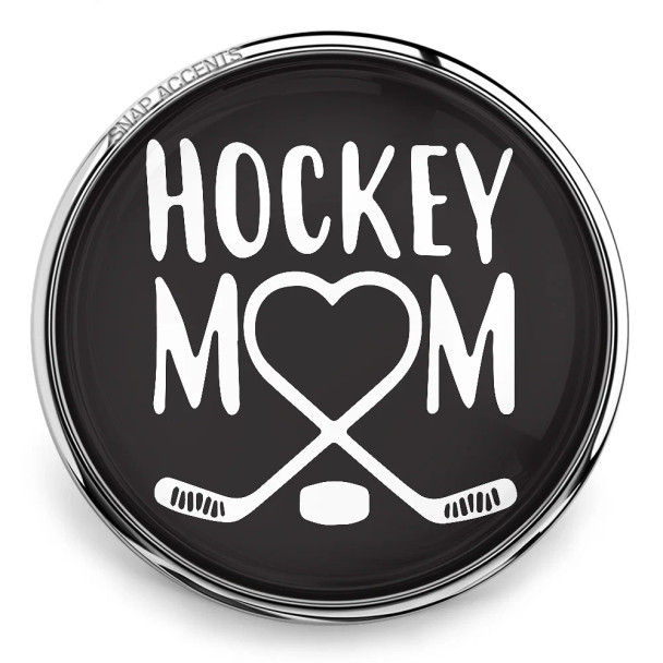 SnapAccents snap jewelry charm with black background, white "Hockey Mom" text, heart-shaped design formed by crossed hockey sticks and puck, perfect gift for hockey moms, sports accessory, interchangeable snap button jewelry.