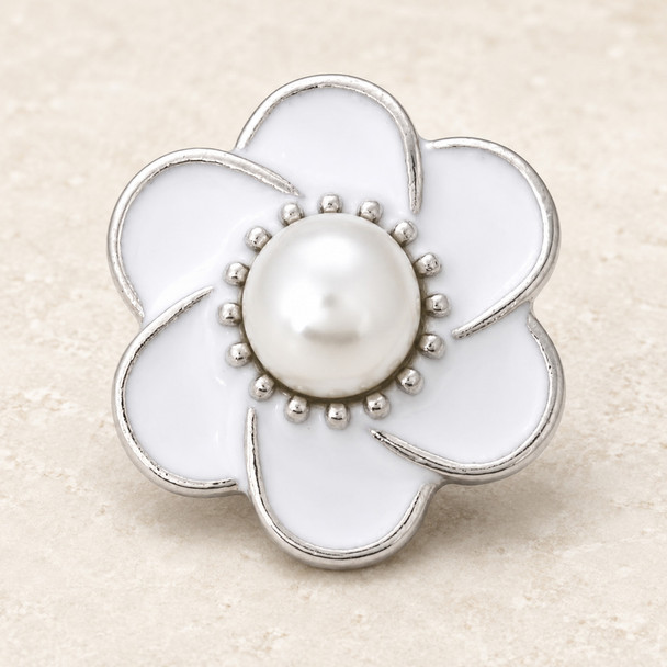 white enamel flower snap jewelry charm with silver edges and a central pearl surrounded by small silver beads