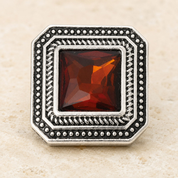 square snap jewelry charm with a faceted brown stone center and decorative silver-tone beaded border