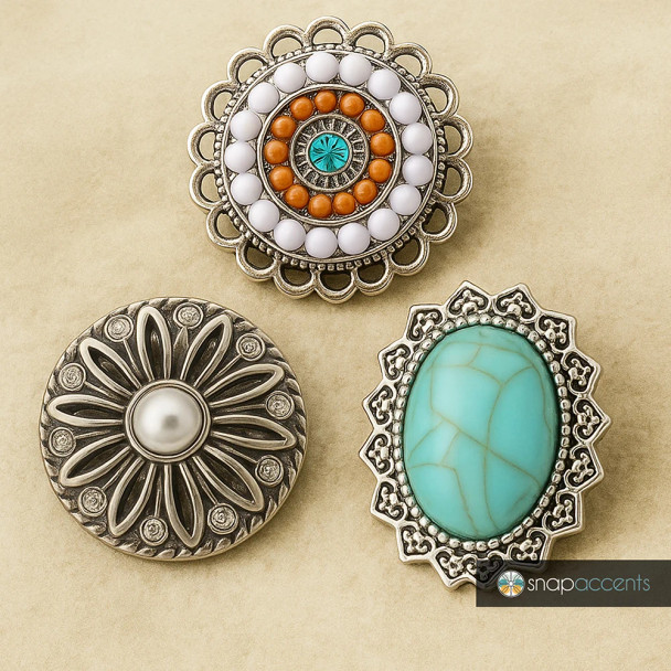 SnapAccents snap jewelry set featuring three interchangeable decorative snaps: a vintage-inspired round snap with white and orange beads and turquoise center, a silver floral snap with pearl and rhinestone accents, and an ornate silver snap with a large turquoise stone, perfect for customizable fashion accessories and jewelry.
