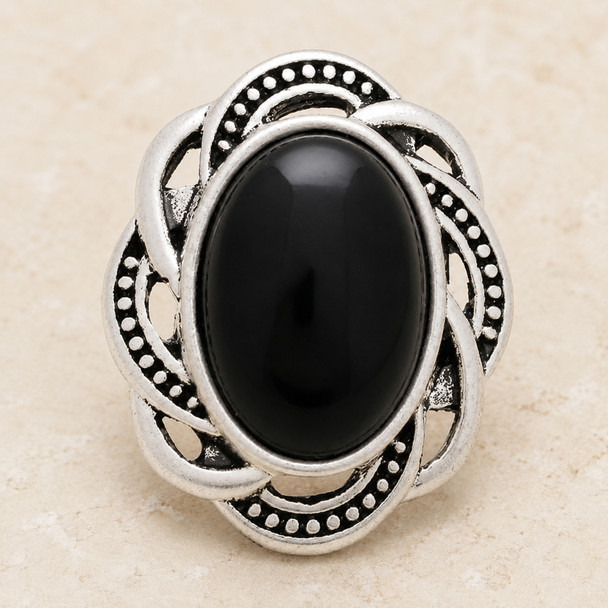 Vintage oval snap jewelry charm with a polished black oval center stone and an intricate silver-toned frame with dotted detailing
