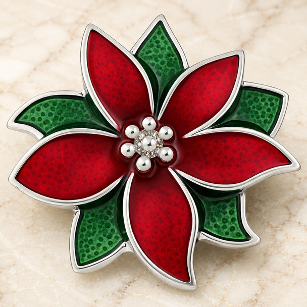 Poinsettia flower snap jewelry charm with red and green enamel petals outlined in silver tone and silver bead accents in the center