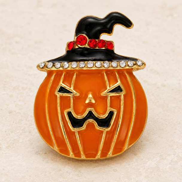 orange enamel pumpkin snap jewelry charm with a black witch hat decorated with red and clear rhinestones