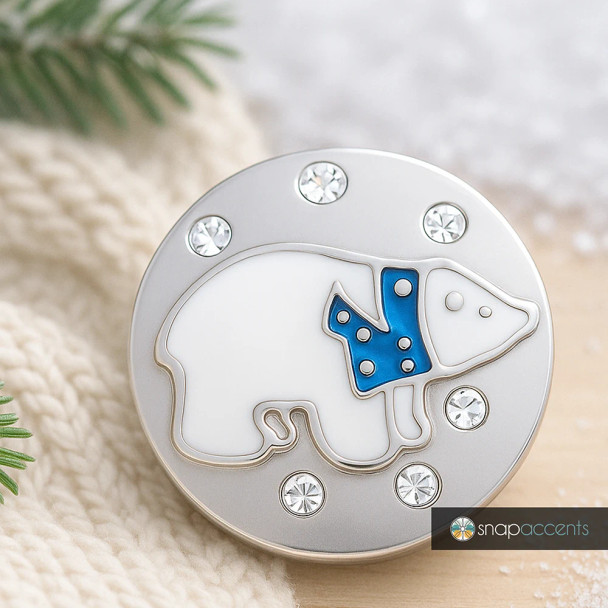 SnapAccents round snap jewelry charm featuring a white polar bear with a blue scarf design, accented with clear rhinestones on a silver-tone metal base, perfect for interchangeable snap bracelets, necklaces, and accessories.