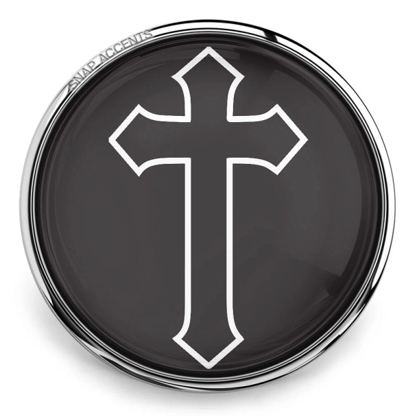 Black SnapAccents snap jewelry charm featuring a bold white outlined cross design, round silver-tone metal frame, interchangeable snap button for bracelets, necklaces, and accessories, religious faith symbol, stylish and versatile snap jewelry accent.