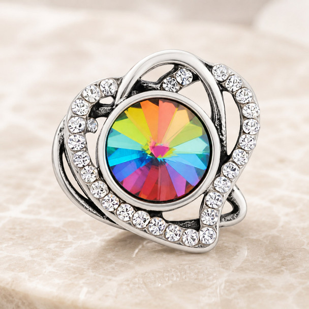 snap jewelry charm with a multicolor faceted crystal center surrounded by a silver heart-shaped frame encrusted with clear rhinestones