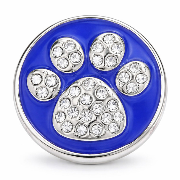 blue snap jewelry charm with a dog paw design made of silver and clear rhinestones on a bright blue enamel background