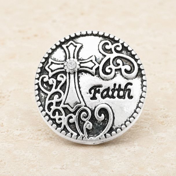round silver snap jewelry charm with a detailed cross featuring a central rhinestone, intricate filigree patterns, and the word Faith engraved