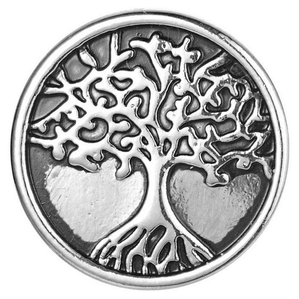 round silver snap jewelry charm with an intricate tree of life design and two heart shapes in the background