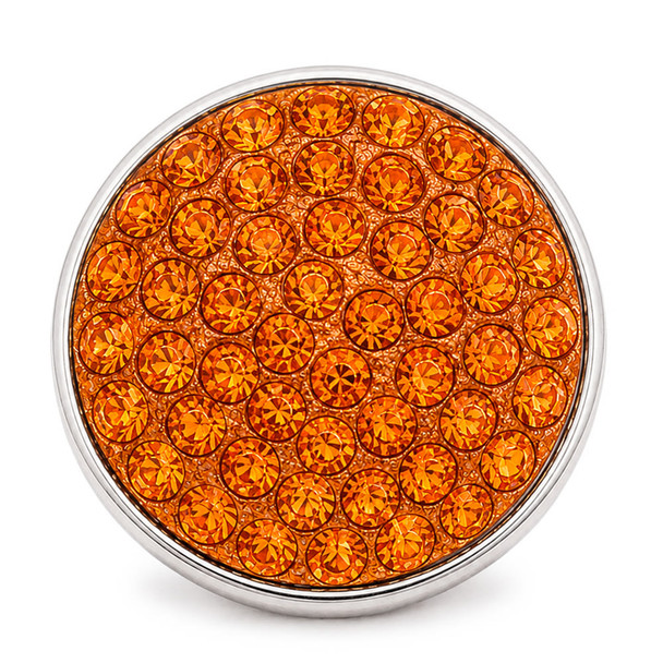 round snap jewelry charm covered in bright orange rhinestones with a silver metal edge