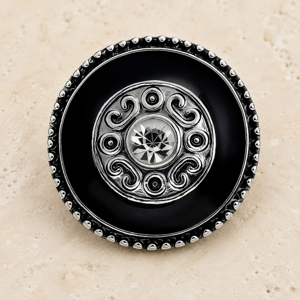 black snap jewelry charm with silver bead border, intricate silver scroll design, and a central clear rhinestone