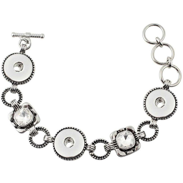 silver-tone snap jewelry bracelet with three snap bases and two antique rhinestone accents linked by textured rings