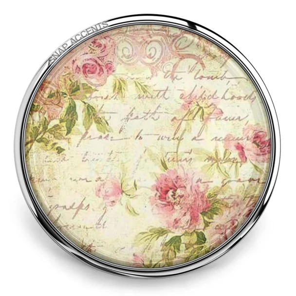 Round SnapAccents snap jewelry charm with vintage floral design and cursive script, featuring soft pink roses and green leaves in a silver-tone metal frame, ideal for interchangeable snap jewelry accessories.
