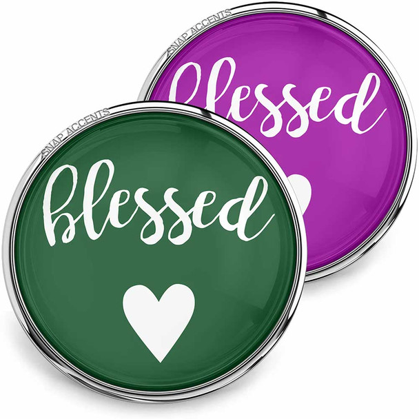 SnapAccents snap jewelry buttons with "blessed" text and heart design, one in green and one in purple, featuring silver metal edges, perfect for interchangeable snap charm bracelets and accessories.