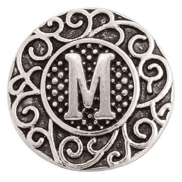 18mm silver snap jewelry charm with a solid letter M center, dotted background, and intricate filigree scrollwork design