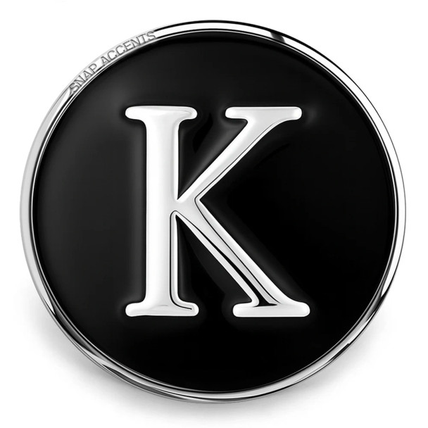 Black SnapAccents snap jewelry charm with silver letter K initial, round metal interchangeable accessory for bracelets and necklaces, personalized fashion statement piece.