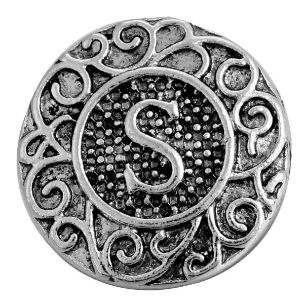 Round silver SnapAccents snap jewelry charm with intricate scrollwork design and raised letter "S" in the center, textured background, vintage style accessory for customizable bracelets and necklaces.