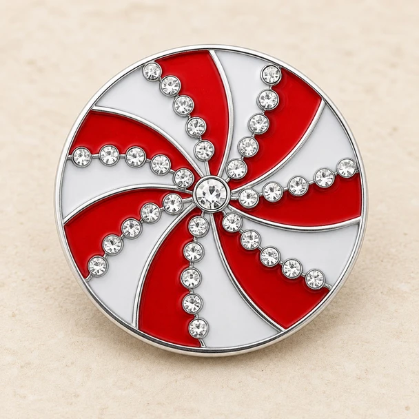18mm snap jewelry charm with a red and white peppermint swirl design accented by clear rhinestones arranged in curved lines and a central rhinestone