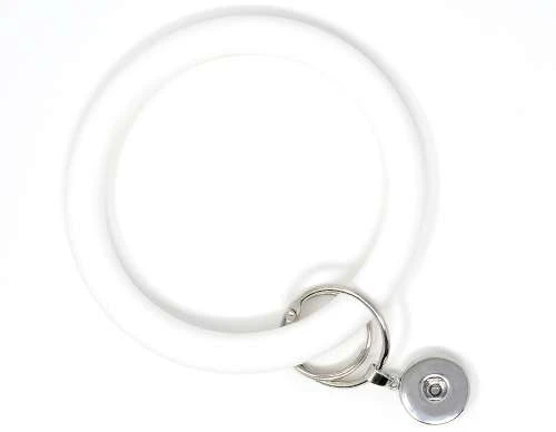 White silicone snap bracelet with silver metal snap button charm holder, adjustable and stylish accessory for interchangeable snap jewelry pieces, perfect for personalized fashion gifts and everyday wear.