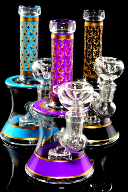 Colorful glass bongs for resale with floral print.