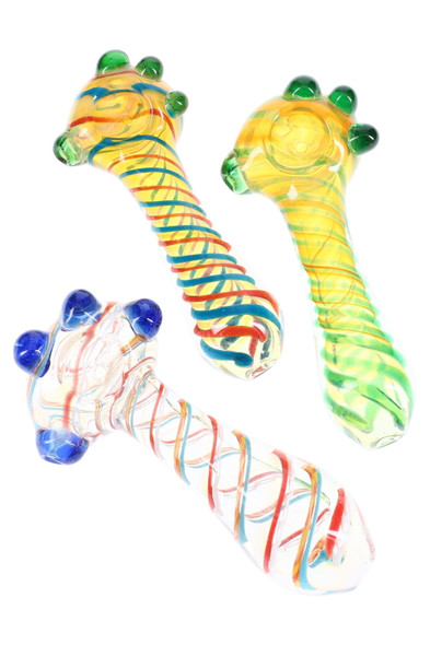Trio of thick 5" clear glass spoon pipes with multicolor spiral stripes and green/blue marble grips, top-down studio angle for wholesale head-shop buyers. Trio of thick 5" clear glass spoon pipes with multicolor spiral stripes and green/blue marble grips, top-down studio angle for wholesale head-shop buyers.