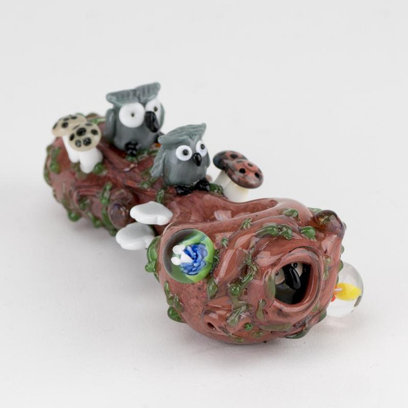 Rear angle on white for head-shop supplies—forest spoon showing flower millie marble, vine texture, and owl sculptures near mouthpiece.
