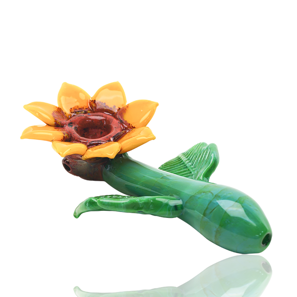 Low-angle sunflower sherlock pipe showing green mouthpiece, side leaves, and yellow petals