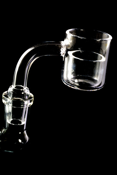 Quartz banger with 24 mm clear insert dish seated, side view on black; wholesale dabbing accessory for head-shop buyers.