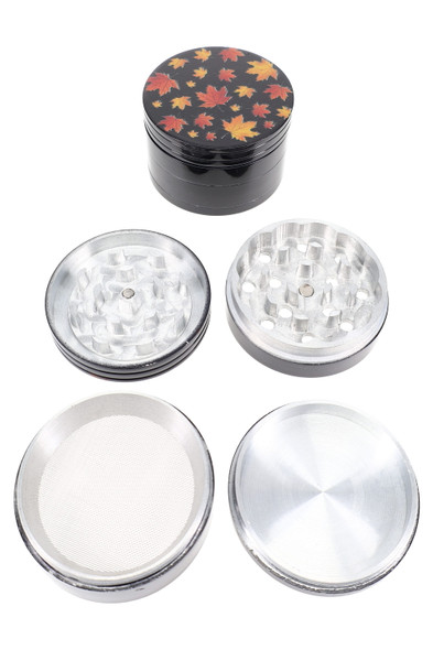 Black 2.25-inch 4-part aluminum metal grinder, Fall Leaves decal, pieces separated with screen and base; wholesale top-down product view.