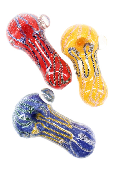 Thick frit glass spoon with bold multicolor striping, compact hand pipe in assorted hues; angled studio view for wholesale head-shop product listings.