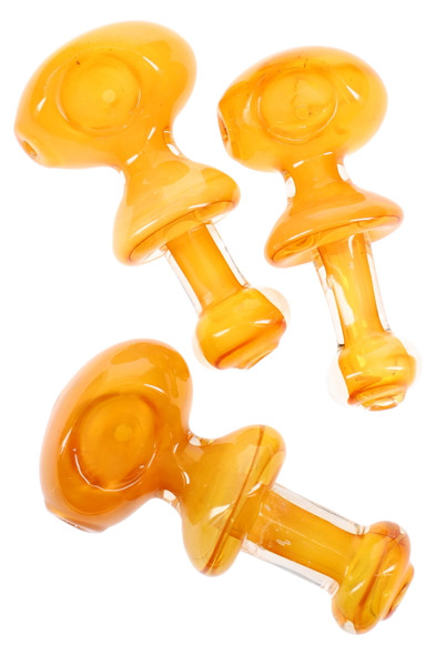 Three 4.5" gold-fumed color-changing ring glass spoons in warm amber; wholesale head-shop product image, top-down studio angle with clear stems.
