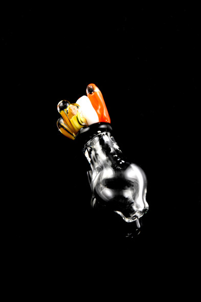 Close-up on black background of coral-themed Peak Pro glass ball cap; compact 1-inch clear piece with orange, white, yellow tips for smoke shop retail.