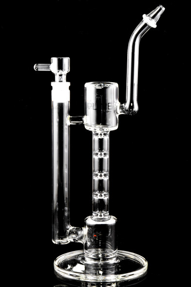 Clear 12" GRAV Upline water pipe on round base with angled mouthpiece and 14.5 mm joint; ladder perc restrictions visible, studio side view for wholesale buyers.
