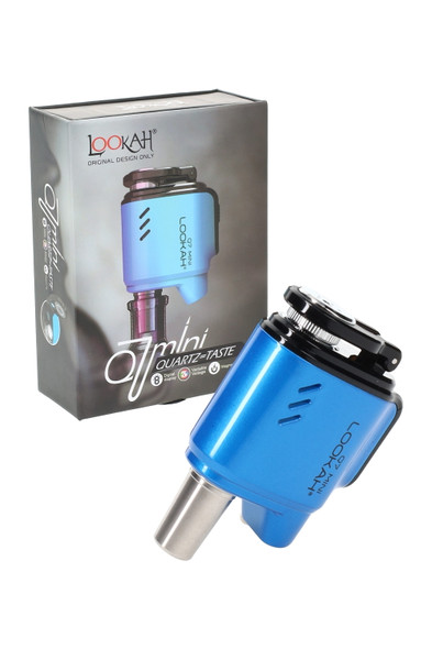 Blue Lookah Q7 Mini e-nail kit beside box; quartz 710 atomizer tip shown; head-shop supplies photo, clean front three-quarter angle. Blue Lookah Q7 Mini e-nail kit beside box; quartz 710 atomizer tip shown; head-shop supplies photo, clean front three-quarter angle.
