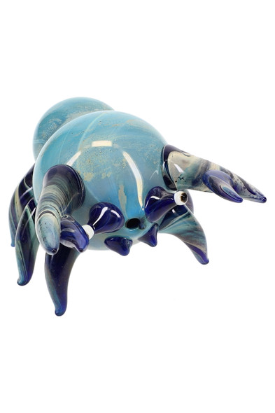 Wholesale 4" silver-fumed color-changing glass crab pipe, blue frit body with sculpted claws and legs, front three-quarter studio view.