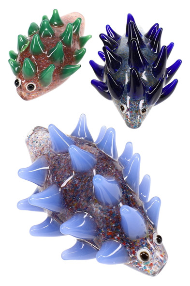 Wholesale 4″ confetti frit glass porcupine pipes, assorted blue/green spike variants, trio layout on white, animal hand pipe set for showcases.