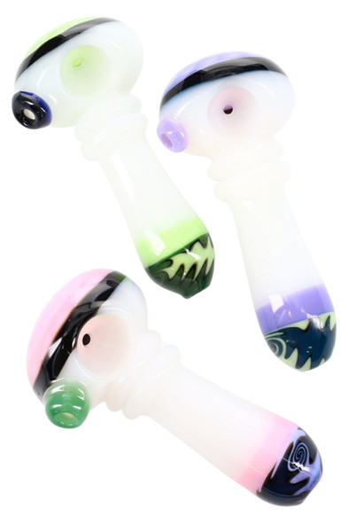 Trio of 4" white glass spoons with neon green, pink, and purple accents, glass rings, and reverse wig-wag mouths; wholesale head-shop product group shot, ~100 g.