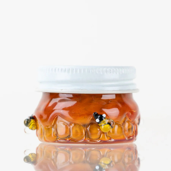 Front view of amber Honeycomb Terp Jar with white metal screw-top lid and bee accents—retail smoke-gear shot, compact 1.5" size.
