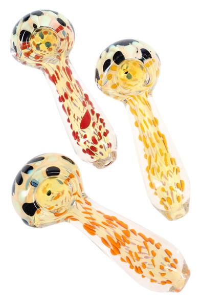 Wholesale 4-inch color-changing clear glass spoon pipe with neon dot frit accents; trio front profile shows assorted retail smoke-gear patterns