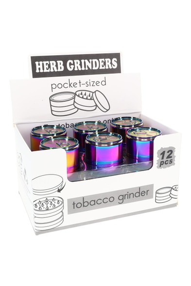Retail display of twelve 1.5-in rainbow zinc-alloy 3-part soda can grinders; shelf-ready wholesale presentation, angled front view.