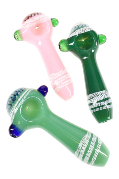 Top-down trio of 4.5" slime-tone glass spoon pipes for wholesale buyers, pink and two greens with white stripes, marbles, and floral fumed bowls. Top-down trio of 4.5" slime-tone glass spoon pipes for wholesale buyers, pink and two greens with white stripes, marbles, and floral fumed bowls.